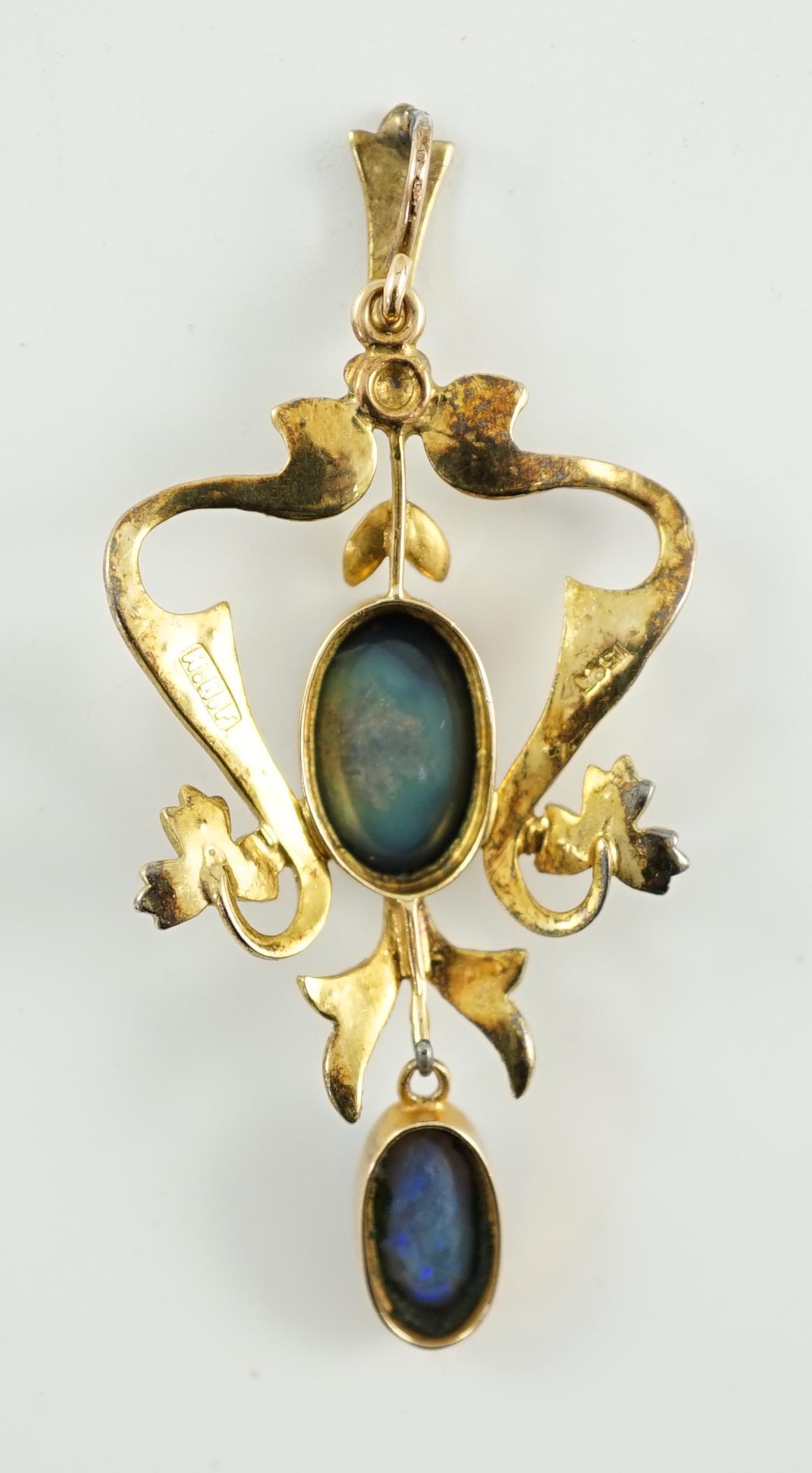 A late Victorian 15ct gold, two stone oval black opal and seed pearl cluster set drop pendant